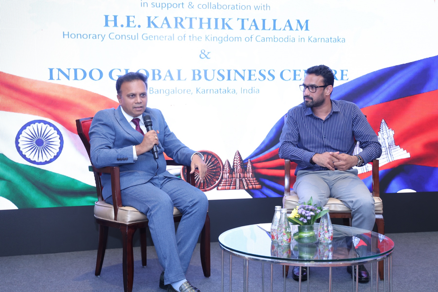 A fireside conversation on stage between forum speakers